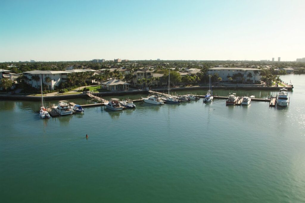 Boats docked at a sunny marina in Boynton Beach, Florida