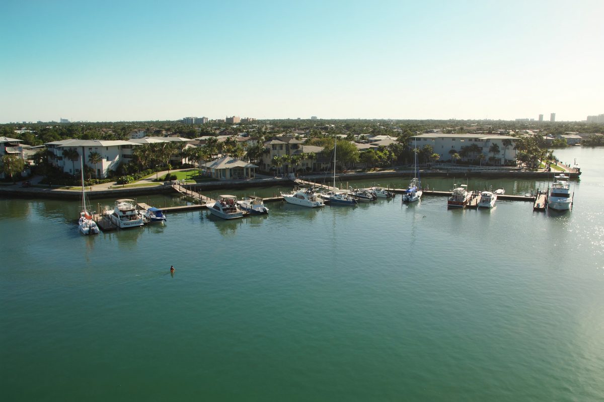 Boats docked at a sunny marina in Boynton Beach, Florida
