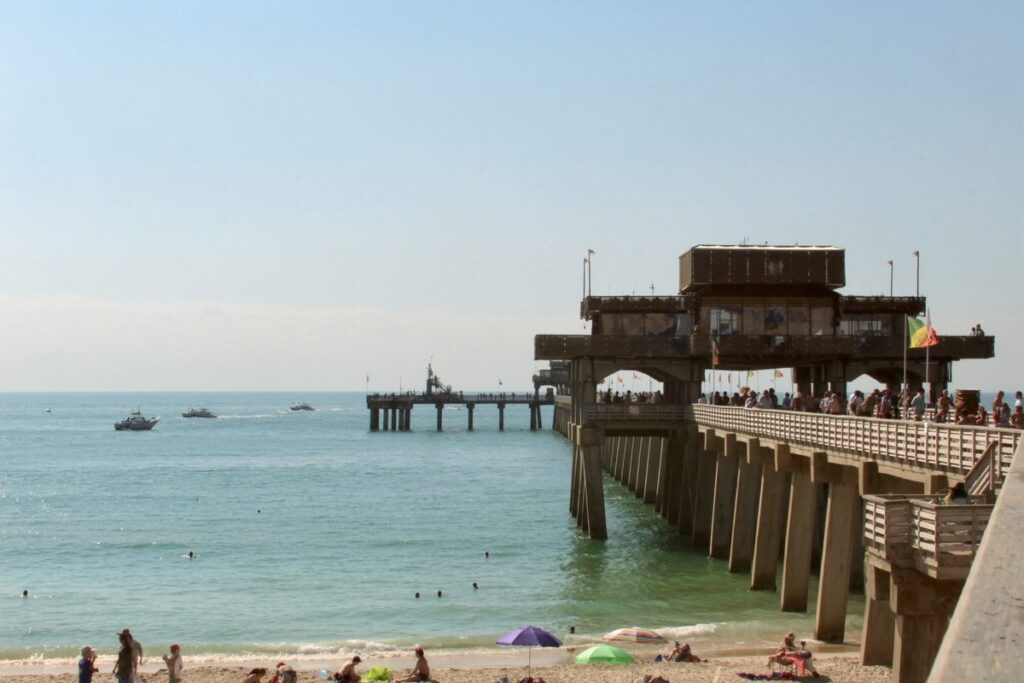 Fishing pier over turquoise water in Deerfield Beach, Florida