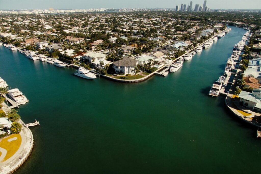 Yachts docked along canals in Fort Lauderdale with the skyline beyond